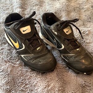 Nike Black and White Cleats with Gold Accent